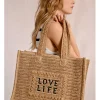 Bolso de rafia trenzada estampado texto