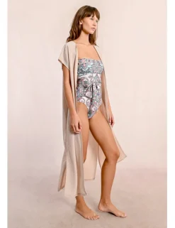 Chaqueta larga en tejido brillante con flecos