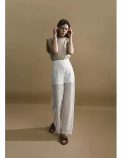 Pantalón largo en tejido bordado y transparencias