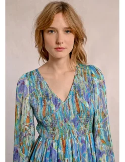 Vestido largo con estampado y volantes